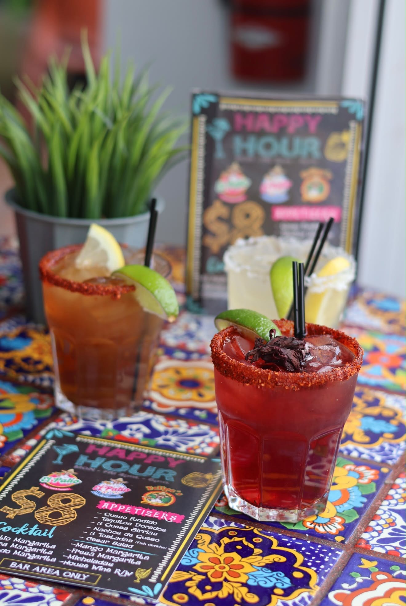 Happy Hour margaritas and micheladas beside the $8 Happy Hour menu at El Patio