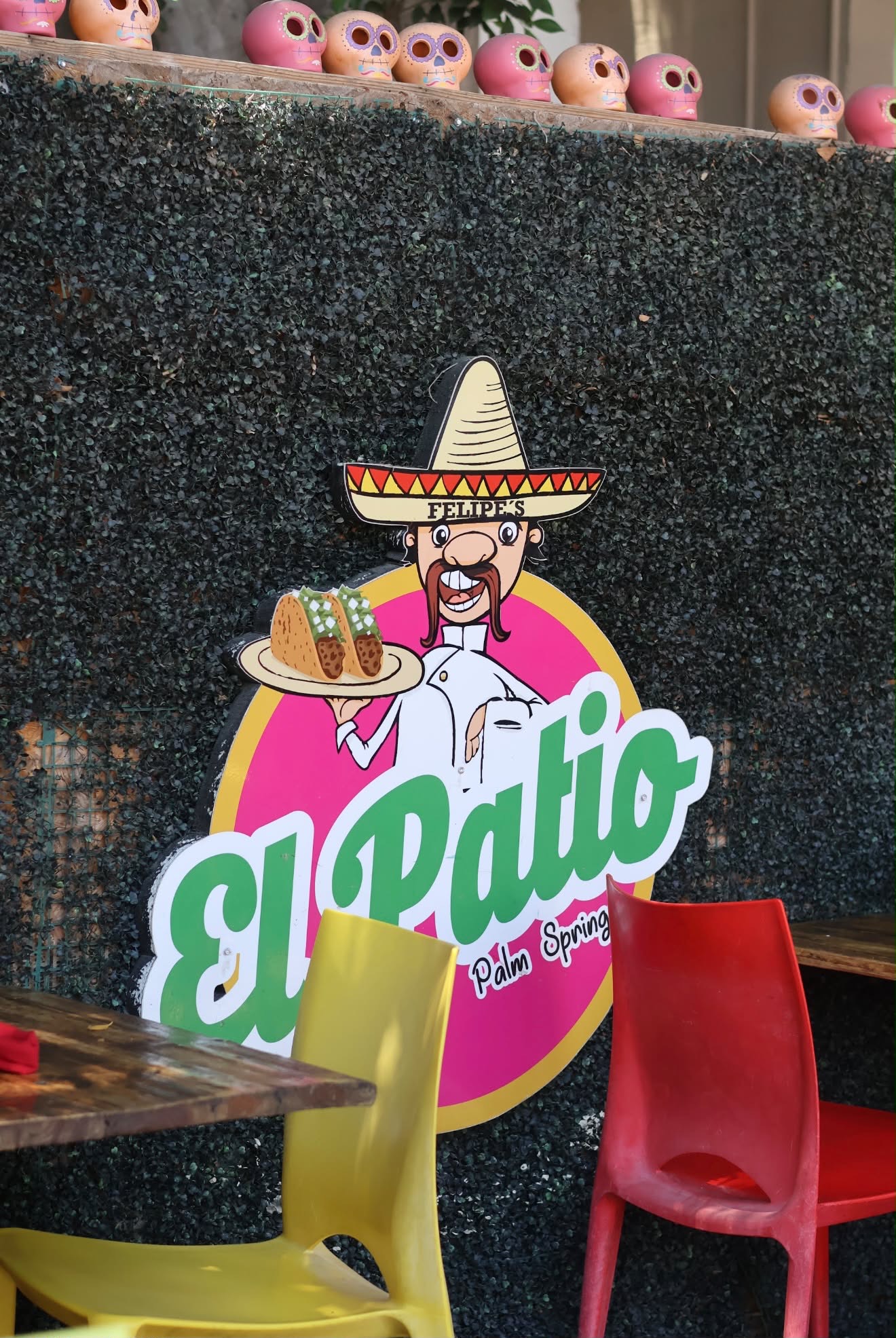 El Patio sign with colorful patio chairs